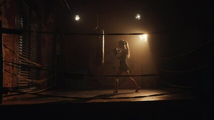 Sport for stay slender and beautiful, active blonde woman training on box ring. Hobby and professional sport occupation, female boxer fighter practicing arms punches, stay healthy and slender, cardio - Powered by Adobe