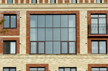 Modern Brick Building Facade with Large panoramic Window Design