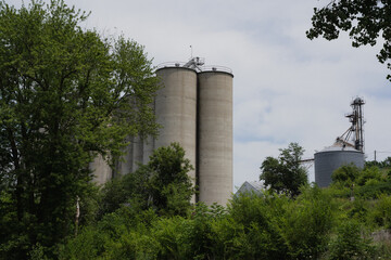 A large grain bun sticks out from the trees in rural Missouri. 