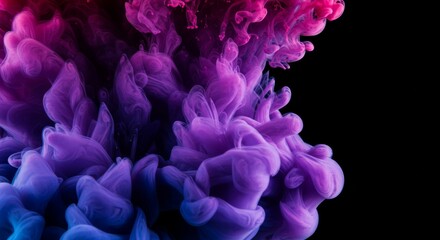 Ink Cloud Mixing in Water with Pink and Blue on Black Background