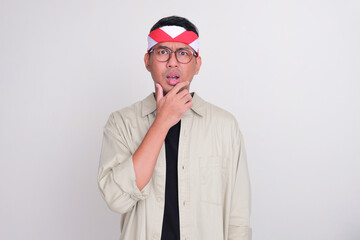 Indonesian man celebrate independence day showing confused face expression