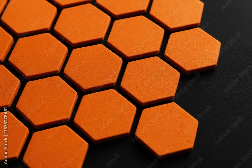 Poster an abstract pattern of orange hexagonal tiles on a black background