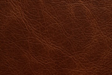 Fototapeta premium A close-up of a rich brown leather surface, showcasing its natural grain and subtle variations that speak to the craftsmanship behind it