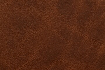 Close-up of a rich brown leather texture with natural creases and folds