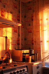 Kitchen illuminated by the rays of the setting sun