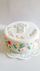 Elegant white fondant cake for baptism ceremony