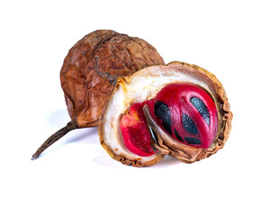 Dried nutmeg fruits with one open showing seed and red mace, isolated on white background, perfect for culinary or herbal use.