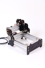 Mini Laser Engraving Machine for Wood on White Background.