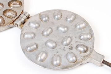 Waffle iron for making cookies with condensed milk in the form of nuts.