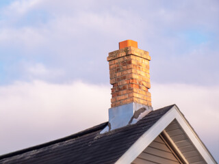 brick chimney on a roof