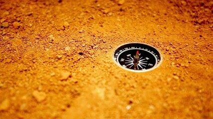 A compass rests on the sandy ground, ready for adventure - Powered by Adobe