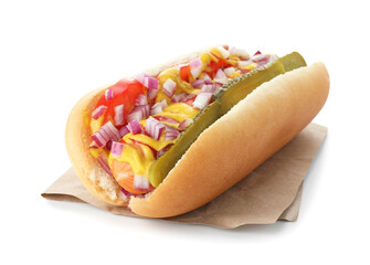 Tasty hot dog with pickles, onion, ketchup and mustard isolated on white