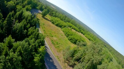 Experience thrilling FPV drone action over a hidden forest racing track - Powered by Adobe