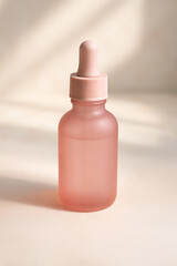 This is an Elegant Pink Glass Dropper Bottle specifically designed for Cosmetic Use purposes
