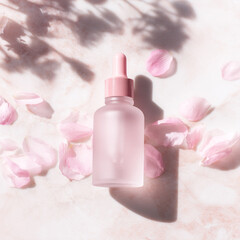 An Elegant Pink Serum Bottle Artfully Surrounded by Delicate Petals for Skincare Beauty