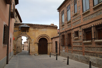 claustra gate and houses in segovia in spain 