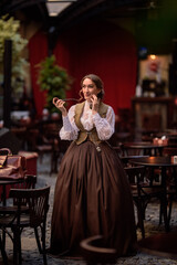 beautiful woman scientist in retro style with smoking pipe