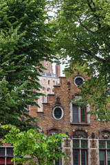 Gable house surrounded by foliage in Brugge in Flanders Belgium
