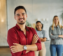 Portrait of a group of young business people having a meeting in the office. Teamwork and success...