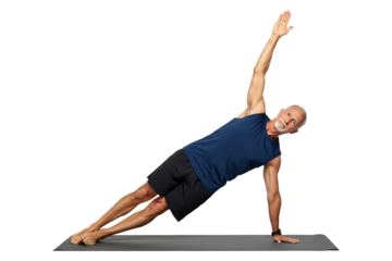 Fit senior man in activewear performing a side plank yoga pose on a mat