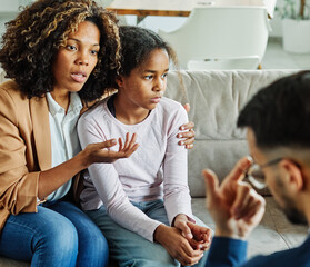 Mother with her teenage daughter at meeting with social worker, psychologist discussing mental...