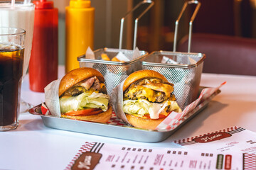 Classic Diner Cheeseburgers with Fries and Drinks