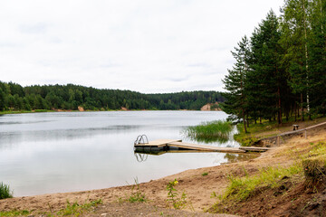 Peaceful Forest Lake with Wooden Dock