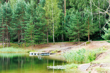Green Lake with Dock and Lush Forest