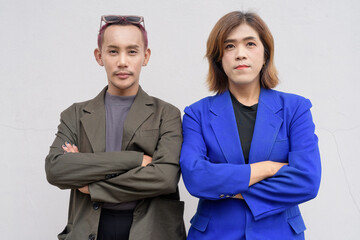 Gender inclusive business team couple against white background