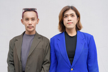 Gender inclusive business team couple against white background