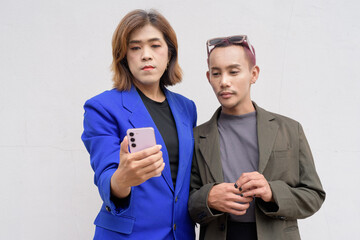 Gender inclusive business team couple against white background