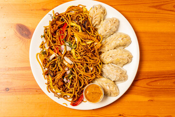 Pork dumplings with chow mein noodles