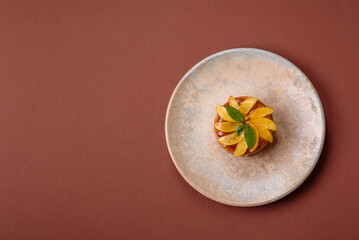 Sweet round pie or tart with apples and peach. Mini sweet tart