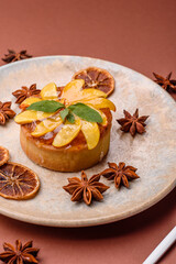 Sweet round pie or tart with apples and peach. Mini sweet tart