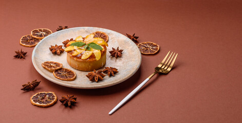 Sweet round pie or tart with apples and peach. Mini sweet tart