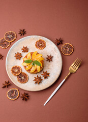 Sweet round pie or tart with apples and peach. Mini sweet tart