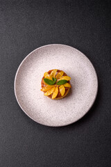 Sweet round pie or tart with apples and peach. Mini sweet tart