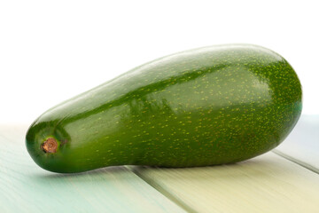 avocado on wood background on white