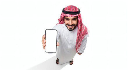Saudi man in traditional attire holding blank smartphone, white background, studio shot.