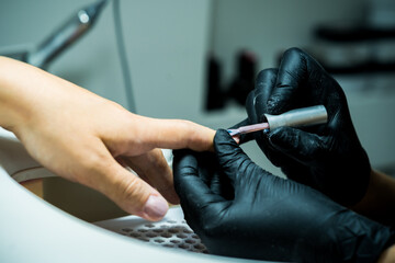 Fototapeta premium Professional Manicure Process at Modern Beauty Salon