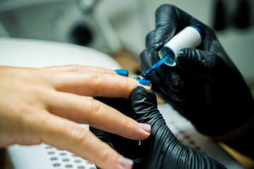 Professional Manicure Process with Electric Nail File at Modern Beauty Salon