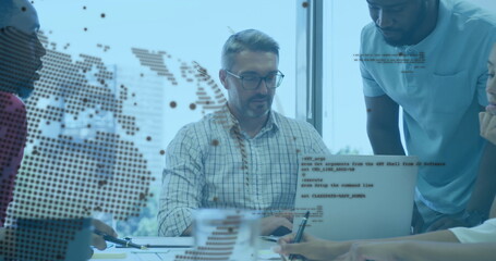 Collaborating team typing and writing notebooks in office, with laptop and world map code overlay