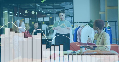 Designer holding garment sample in modern office lounge, with hanger and clothing rack © vectorfusionart