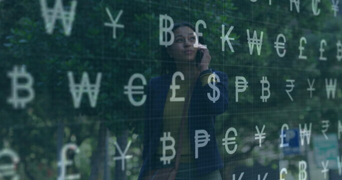 Talking businesswoman holding smartphone in landscaped courtyard, with currency symbols overlay