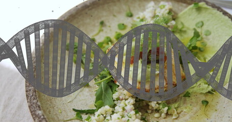 Presenting vegetarian plate featuring pan-fried patty on table with grain salad and green sauce