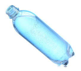 Plastic bottle with clean water in air on white background