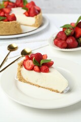 Delicious cheesecake with strawberries and mint on white wooden table, closeup