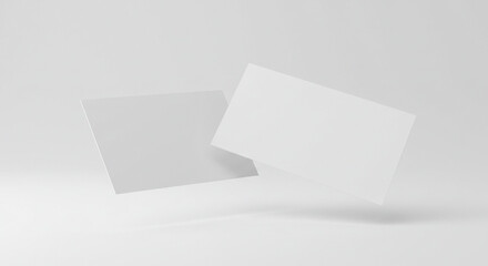 Clean white business cards mockup floating on a light gray background