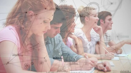 Fourth student lifting hand initiating chat, workshop students writing at table under data overlay - Powered by Adobe