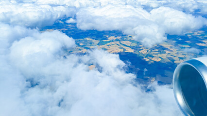 Cloud view from above representing global travel, tourism, and air movement.